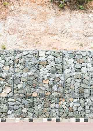 Stone wall  for protect rock fall down and erosion from hill in Thailandの写真素材