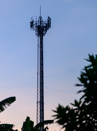 Silhouette cell phone towers with twilight sky.の写真素材