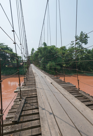 Hanging bridge across river in Nan province Thailandの写真素材