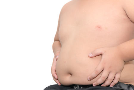 The size of stomach of children with overweight isolated on white backgroundの写真素材