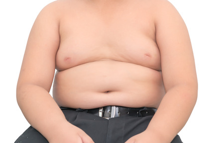 The size of stomach of children with overweight isolated on white backgroundの写真素材