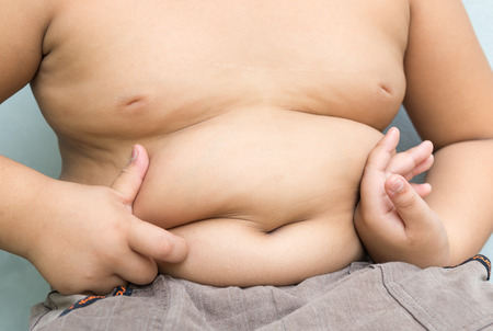 abdominal surface of asian fat boyの写真素材