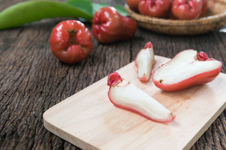 fresh slice rose apple on wood plateの写真素材