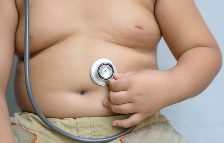 Hand boy check stomach by stethoscopeの写真素材