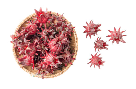 roselle fruit in bamboo basket isolated on white with clipping path