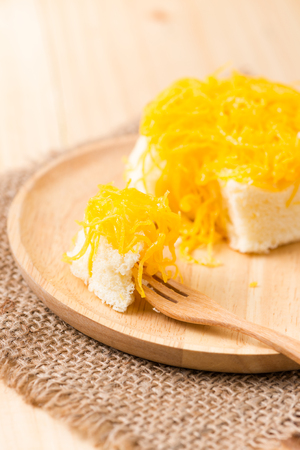 Sweet egg floss cake on wood backgroundの写真素材