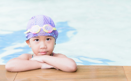 Thai cute girl in swimming poolの写真素材
