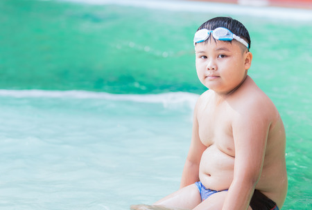 cute thai fat boy on swimsuitの写真素材