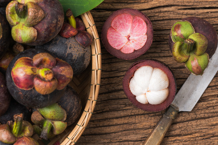 Queen of Fruit, Mangosteen on wood backgroundの写真素材