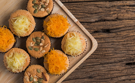 mamon cake or cupcake on wood backgroundの写真素材