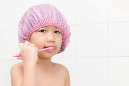 cute girl don't like to brushing teeth, cause tooth decayの写真素材
