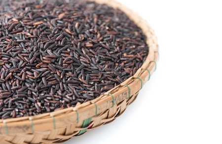 closed up of rice berry  on bamboo basket isolated on white background, healthy food and diet concept.の写真素材