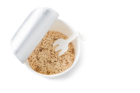 Instant noodles with plastic fork isolated on white backgroundの写真素材