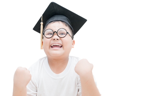 Happy and  very glad asian school kid graduate with graduation cap isolated on white background.の写真素材