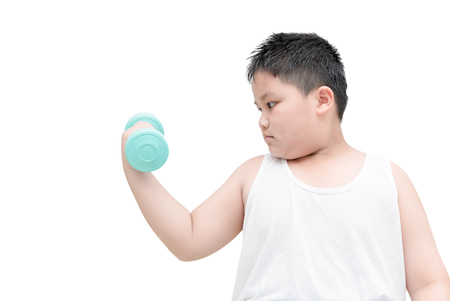 obese fat boy is doing exercises with dumbbells; isolated on white background with copy space.の写真素材