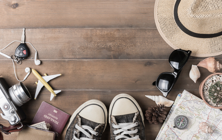Travel plan, trip vacation accessories for trip, tourism mockup - Outfit of traveler on wooden background. Flat layの写真素材