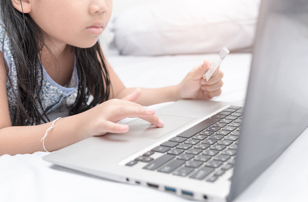 Online shopping.Hands holding credit card and using laptop. selective focus.の写真素材