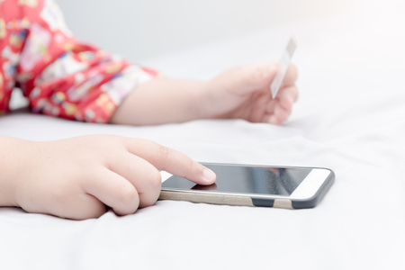 Online shopping.Hands holding credit card and using smartphone. selective focus.の写真素材
