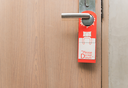 Do not disturb sign on door knob in hotel.の写真素材