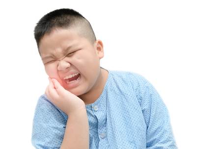 Obese asian fat boy suffering from toothache isolated on white background - Dental problemの写真素材
