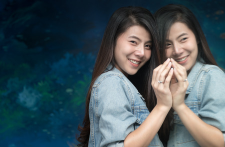 portrait of cute young woman in jacket jeans smile near mirror..の写真素材