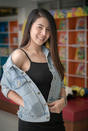 cute young asian woman in jacket jeans smile and looking at camera, Happy and relax concept.の写真素材