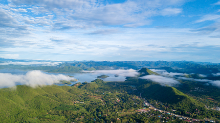 Aerial view of Kaeng Krachan dam with cloudy sky and morning Mist at Tropical Mountain Range,Phetchaburi Thailand.の写真素材