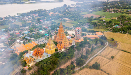 Landscape of Wat Tham Suea, Kanchanaburi Thailand with Smoke from burning rice stubble.のeditorial素材