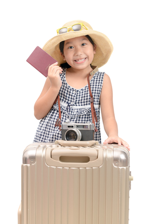 Happy asian traveler showing passport with baggage isolated on white background, travel and vacation concept..の写真素材