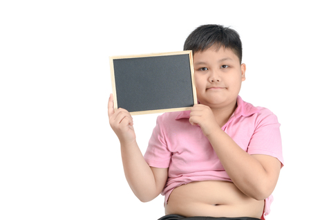Obese fat boy show blank blackboard isolated on whiteの写真素材