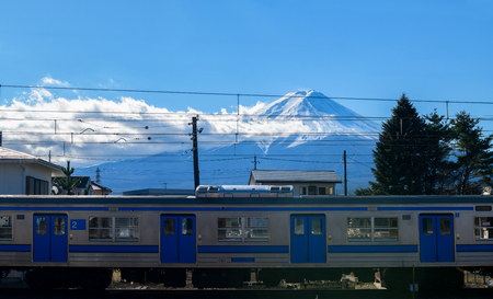 Mountain Fuji and trains on railway at Kawaguchiko train station in Yamanashi prefecture Japan.の写真素材
