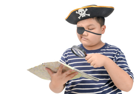 Fat pirate using magnifying glass to view the map isolated on whiteの写真素材