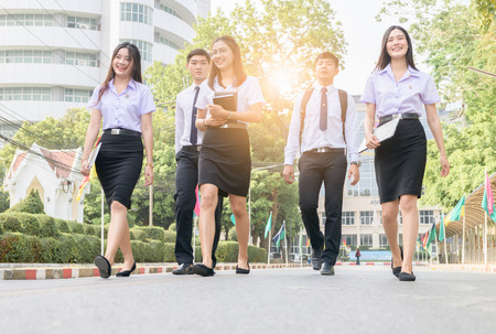 Happy and smart student walking on road at university, Education and back to school concept.の写真素材
