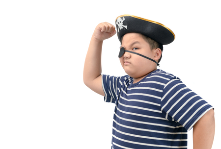 A happy young fat boy wearing a pirate costume show muscle isolated on whiteの写真素材