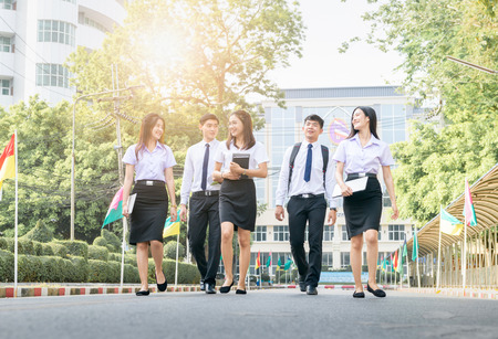 Happy and smart student walking on road at university, Education and back to school conceptの写真素材
