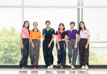 Smart young students wear sport suit and standing together on in Gymnasium, Education and sport...