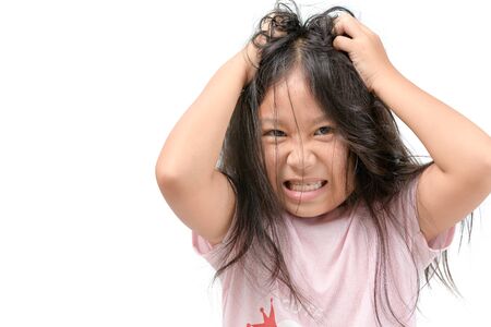 Girl itchy his hair or frustrated and angry kid isolated whiteの写真素材