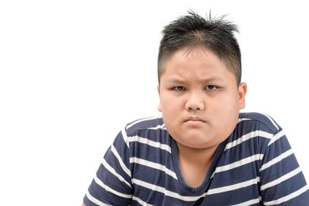 Obese fat asian boy angry expressing negative emotion, annoyed with someone isolated on whiteの写真素材