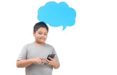 Obese fat boy play smartphone with empty blue speech bubble isolated on white background,...