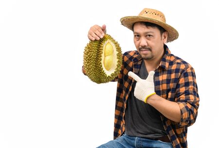 king of fruit in Thailand , Asian man farmer holding Mon Thong Durian isolated on white background and copy space, Summer fruits, popular and expensive of all Thai fruits.の写真素材