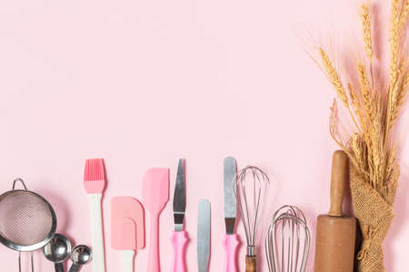Kitchen utensils for pastries on pink  background, prepare for make cake and bakery conceptの写真素材