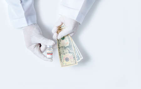 Scientists wear rubber gloves carrying COVID-19 vaccine bottles and us dollars isolated on white