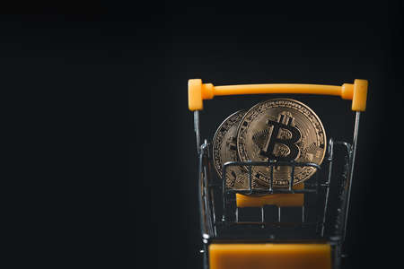Bit coin in yellow trolleyの写真素材