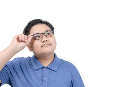 smart boy student wear glasses thinking and looking in side over white background. education conceptの写真素材