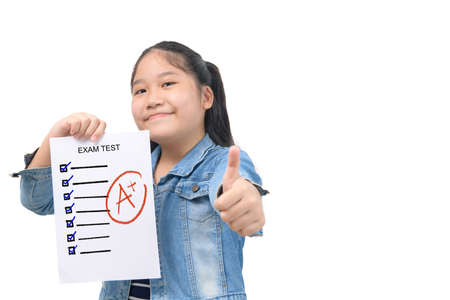 cute smart girl student showing  perfect grade test ressults isolated on white background, education conceptの写真素材