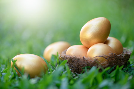 golden eggs on green grass to represent wealth and luck, easter day concept.の写真素材