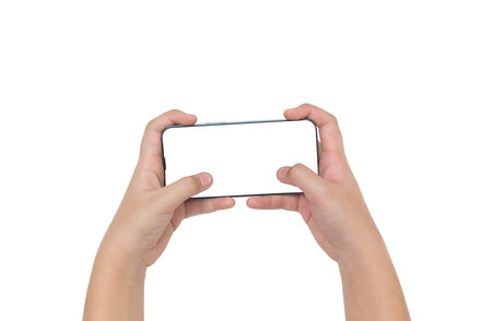 Female hands holding modern moblie phone in horizontal position, isolated on white backgroundの写真素材