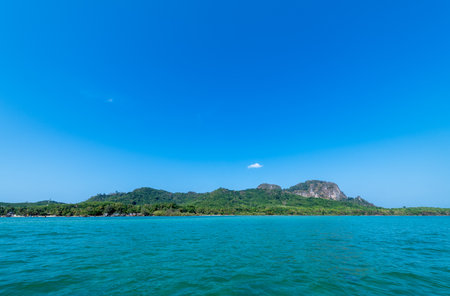 Side view of Koh mook or mook island with blue sky in summer,Trang. It is a small idyllic island in the Andaman Sea in the south of Thailand.の写真素材