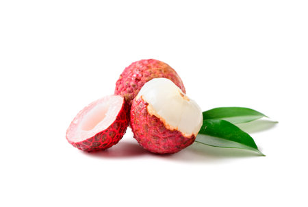 Juicy Lychee with cut in half and leaves isolated on white background.の写真素材
