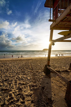 Lifeguard tower and more people on the beach.のeditorial素材
